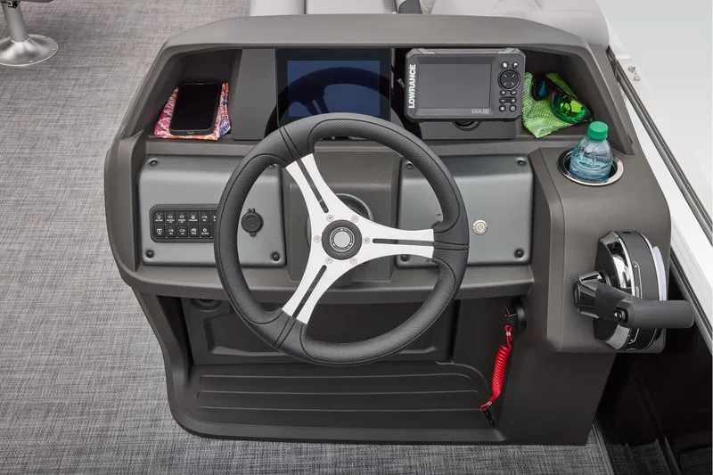 Slide: The Image of Manufacturer Provided Image: 2026 Sun Tracker SportFish 20 DLX helm with steering wheel, controls, and navigation equipment. - 41