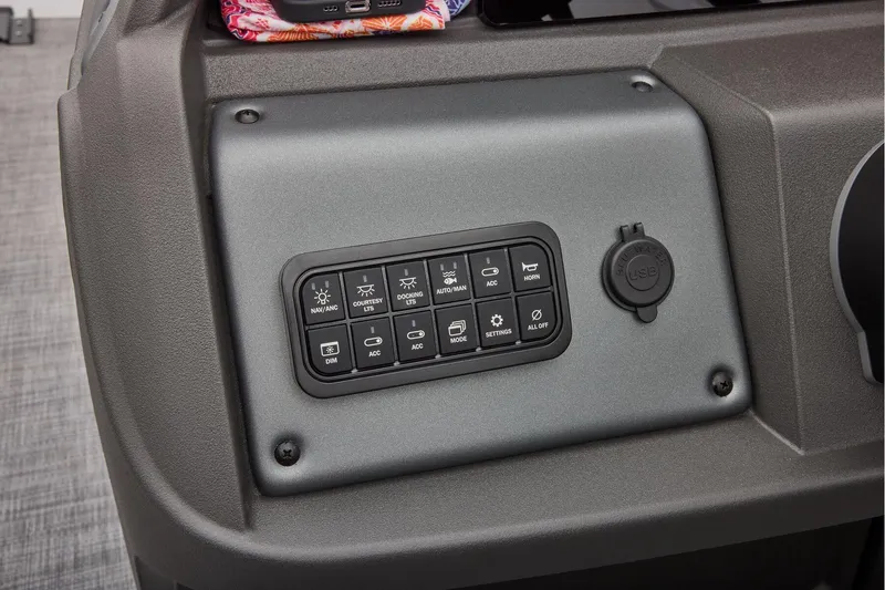 Slide: The Image of Manufacturer Provided Image: Control panel of 2026 Sun Tracker SportFish 20 DLX with USB port and various switches. - 42