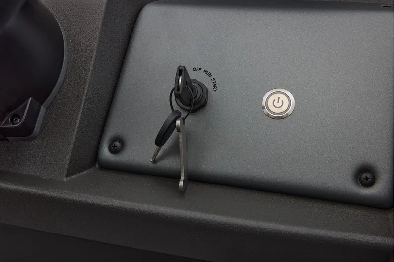 Slide: The Image of Manufacturer Provided Image: 2026 Sun Tracker SportFish 20 DLX ignition panel with keys and power button. - 44