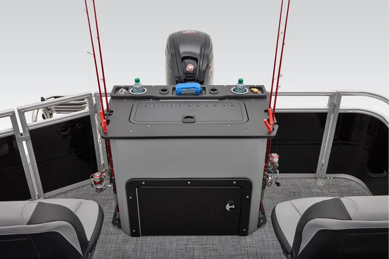 Slide: The Image of Manufacturer Provided Image: 2026 Sun Tracker SportFish 20 DLX boat interior with fishing rods and motor. - 58