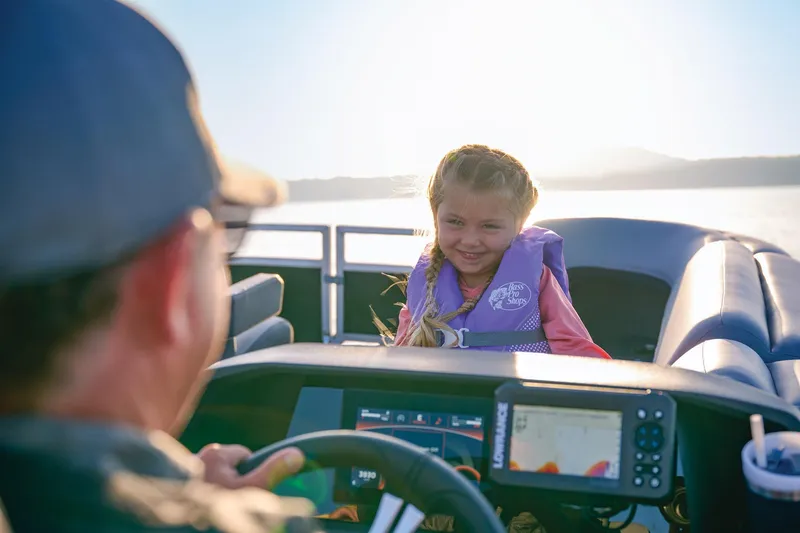 Slide: The Image of Manufacturer Provided Image: Child enjoying a ride on a 2026 Sun Tracker SportFish 20 DLX boat. - 73