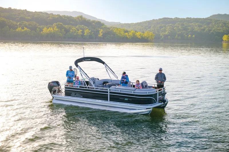 Slide: The Image of Manufacturer Provided Image: 2026 Sun Tracker SportFish 20 DLX pontoon boat on a serene lake. - 74