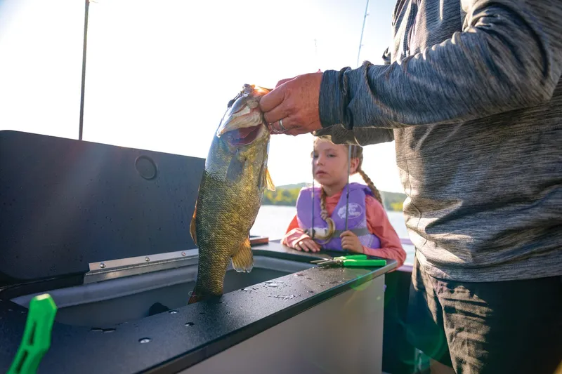Slide: The Image of Manufacturer Provided Image: Man and child fishing on 2026 Sun Tracker SportFish 20 DLX boat. - 75