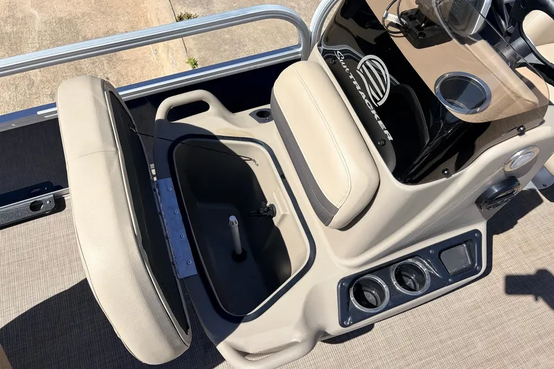Slide: The Image of 2021 Sun Tracker Bass Buggy 16 XL boat interior with open storage compartment. - 21