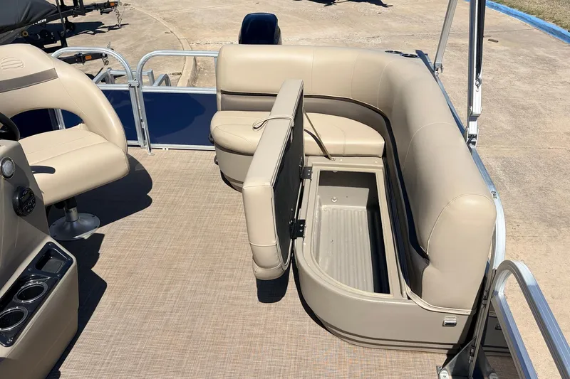 Slide: The Image of 2021 Sun Tracker Bass Buggy 16 XL pontoon boat interior with open storage compartment. - 27