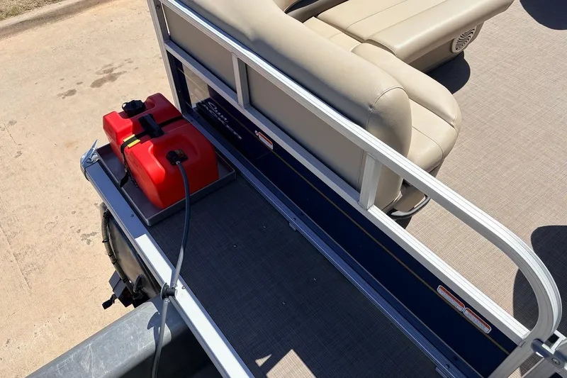 Slide: The Image of 2021 Sun Tracker Bass Buggy 16 XL pontoon boat with red fuel tank and beige seating. - 29