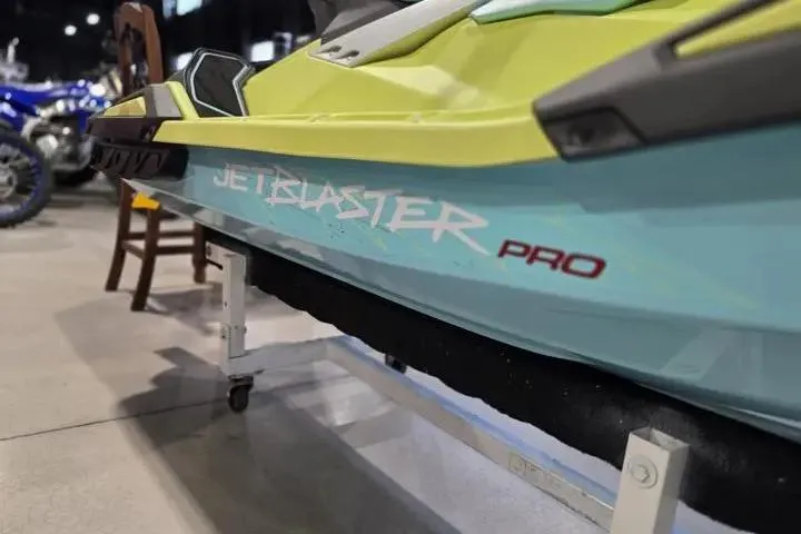 Slide: The Image of 2025 Yamaha WaveRunner JetBlaster PRO 3-Up in showroom, vibrant design and sleek build. - 11
