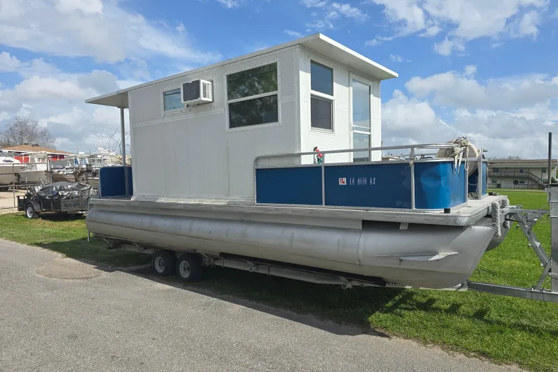 The Image of 2003 Godfrey 24 pontoon boat with cabin and air conditioning on trailer. - 0