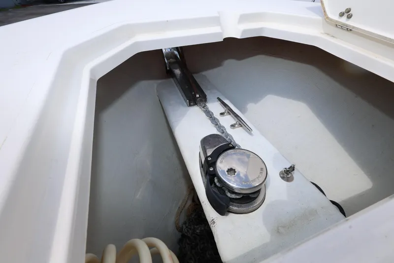 Slide: The Image of Anchor locker of 2019 Cobia 320 Center Console boat with chain and winch. - 17