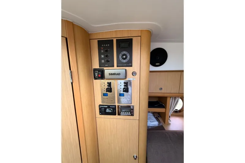 Slide: The Image of Interior of 2013 Beneteau Flyer GT 34 with mounted TV and porthole window. - 10
