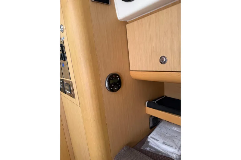 Slide: The Image of Control panel inside 2013 Beneteau Flyer GT 34 yacht, featuring Simrad electronics. - 11