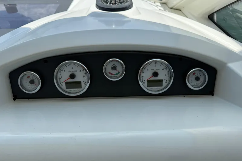 Slide: The Image of Dashboard of 2013 Beneteau Flyer GT 34 with gauges and compass. - 4