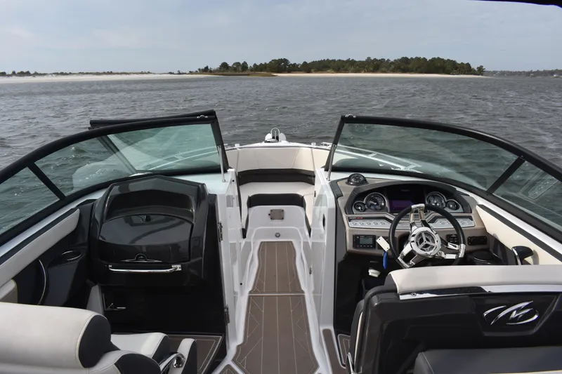 Slide: The Image of 2024 Monterey 255SS Super Sport boat interior with sleek dashboard and steering wheel. - 11