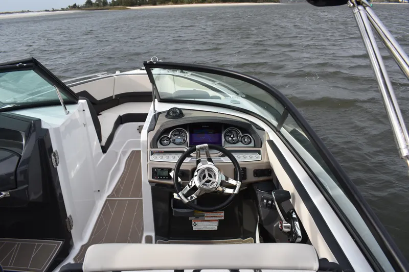 Slide: The Image of 2024 Monterey 255SS Super Sport boat interior with sleek dashboard and steering wheel. - 17