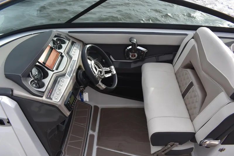 Slide: The Image of 2024 Monterey 255SS Super Sport boat cockpit with modern steering and controls. - 19