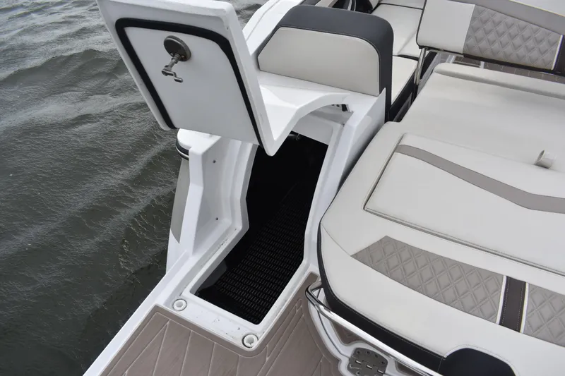 Slide: The Image of 2024 Monterey 255SS Super Sport boat interior with open storage compartment. - 23