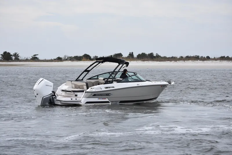 Slide: The Image of 2024 Monterey 255SS Super Sport boat cruising on open water. - 3