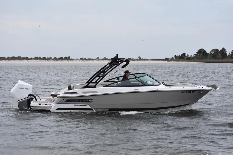 Slide: The Image of 2024 Monterey 255SS Super Sport boat cruising on open water. - 4