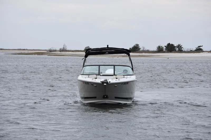 Slide: The Image of 2024 Monterey 255SS Super Sport boat cruising on open water. - 5