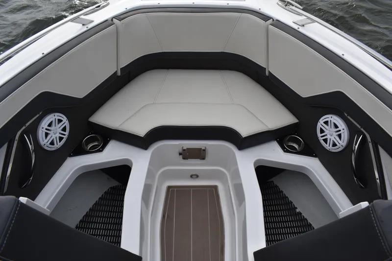 Slide: The Image of 2024 Monterey 255SS Super Sport boat interior with cushioned seating and built-in speakers. - 7