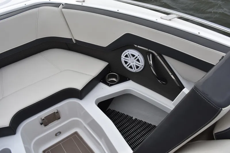 Slide: The Image of 2024 Monterey 255SS Super Sport boat interior with cushioned seating and speaker. - 9