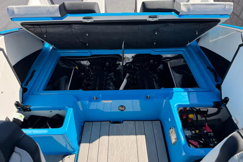 Slide: The Image of 2023 Yamaha Boats 222XD engine compartment with open hatch, showcasing dual engines and storage. - 22