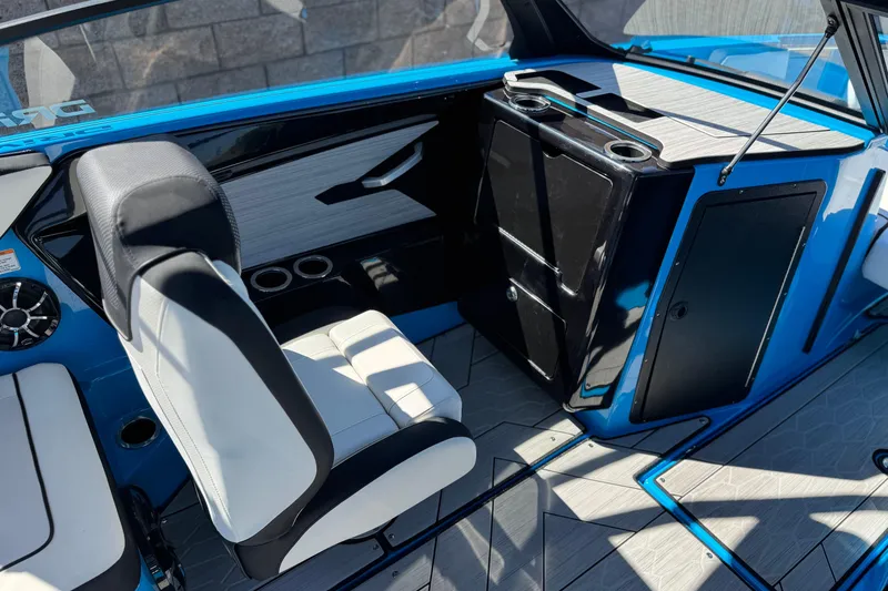 Slide: The Image of 2023 Yamaha Boats 222XD interior with sleek seating and modern dashboard design. - 24