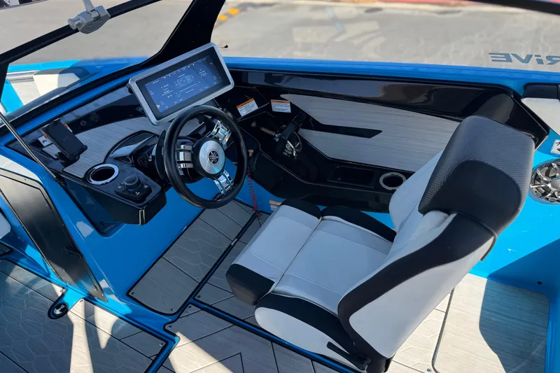 Slide: The Image of 2023 Yamaha Boats 222XD cockpit with modern steering and digital display. - 27