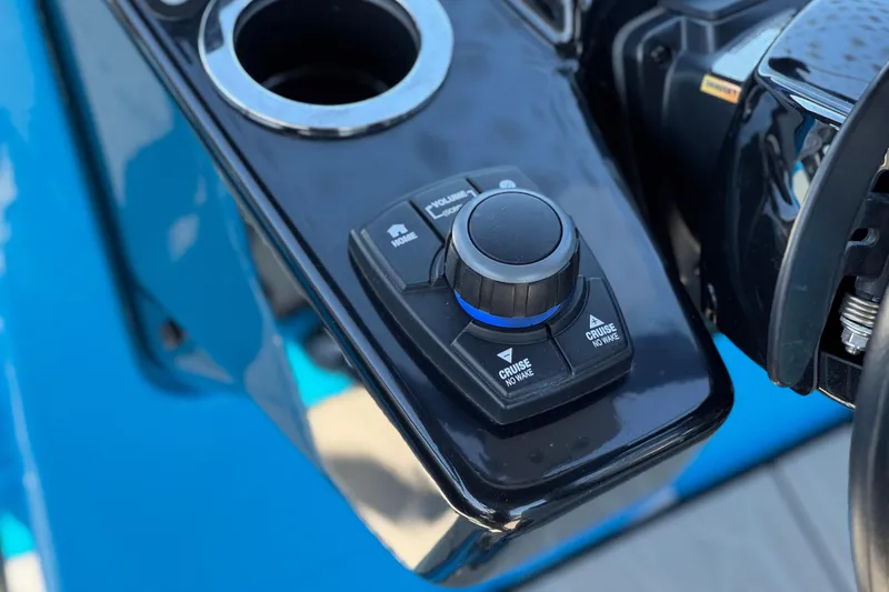 Slide: The Image of Close-up of 2023 Yamaha Boats 222XD control panel with cruise settings. - 29