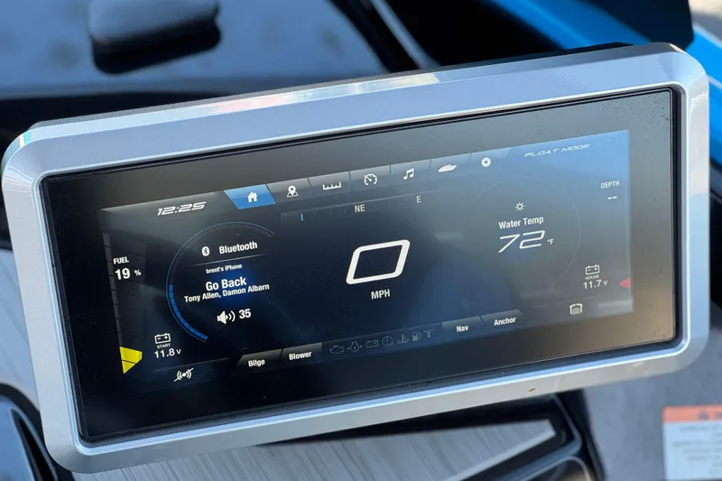 Slide: The Image of 2023 Yamaha Boats 222XD dashboard display showing speed, water temperature, and Bluetooth connectivity. - 30