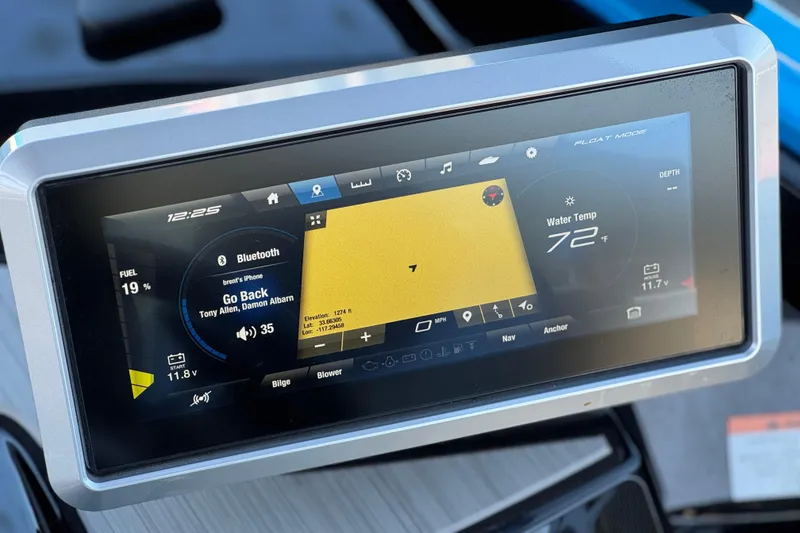 Slide: The Image of 2023 Yamaha Boats 222XD dashboard display showing navigation, music, and water temperature. - 31