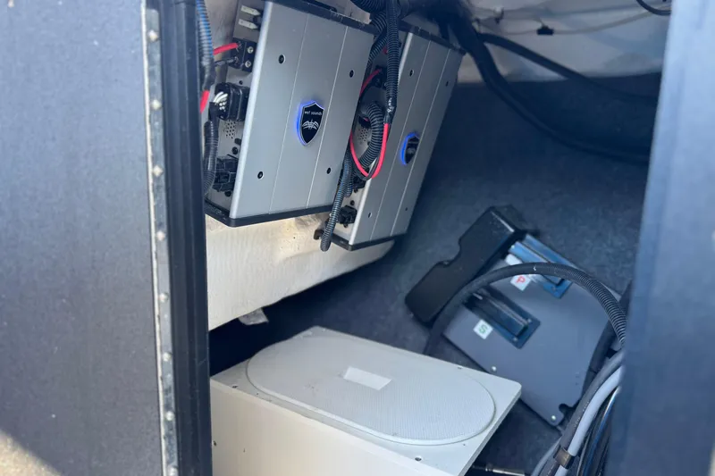 Slide: The Image of Interior view of 2023 Yamaha Boats 222XD, showcasing electronic components and wiring. - 37