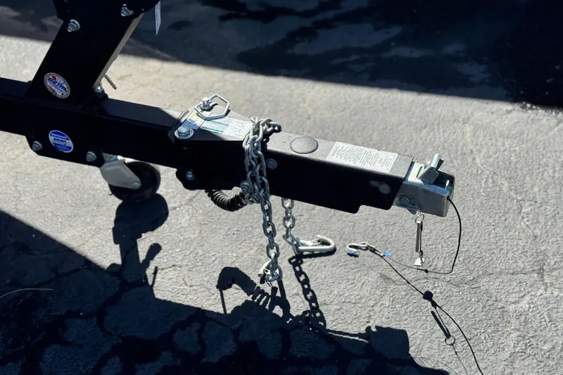 Slide: The Image of Trailer hitch of 2023 Yamaha Boats 222XD on asphalt surface. - 39