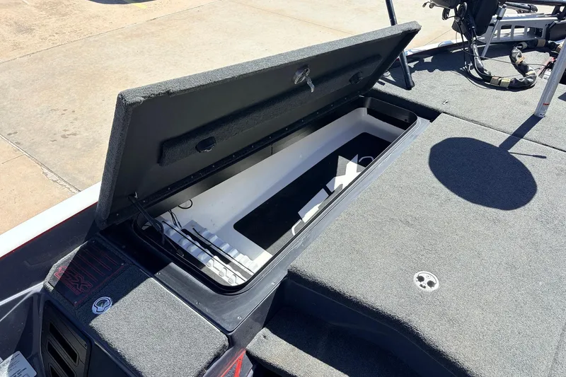 Slide: The Image of 2019 Skeeter FX21 Apex boat with open storage compartment on deck. - 13