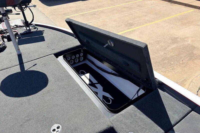 Slide: The Image of 2019 Skeeter FX21 Apex boat storage compartment open, showcasing interior design. - 15