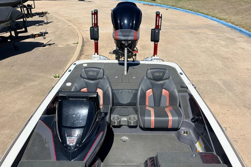 Slide: The Image of 2019 Skeeter FX21 Apex boat interior with dual seats and Humminbird electronics. - 21