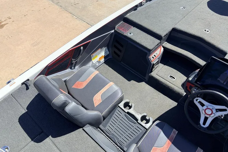 Slide: The Image of 2019 Skeeter FX21 Apex boat interior with steering wheel and seating area. - 24