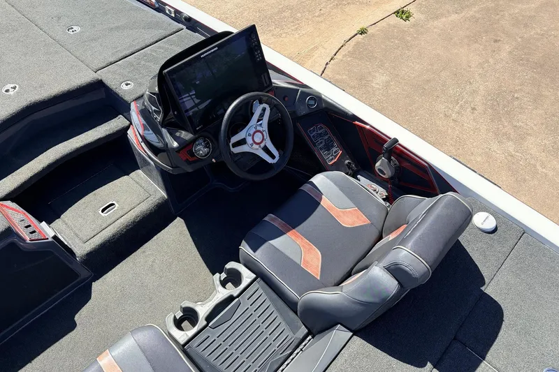 Slide: The Image of 2019 Skeeter FX21 Apex boat cockpit with steering wheel and seating. - 25
