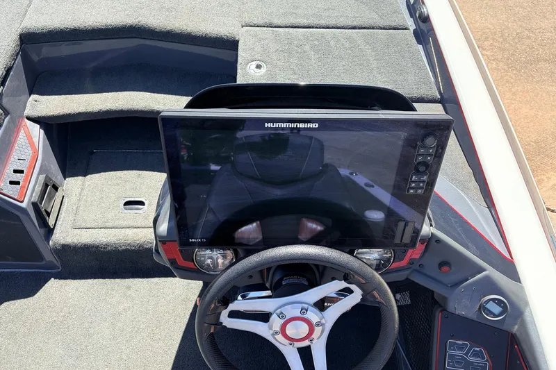Slide: The Image of 2019 Skeeter FX21 Apex boat dashboard with Humminbird Solix 15 display and steering wheel. - 26
