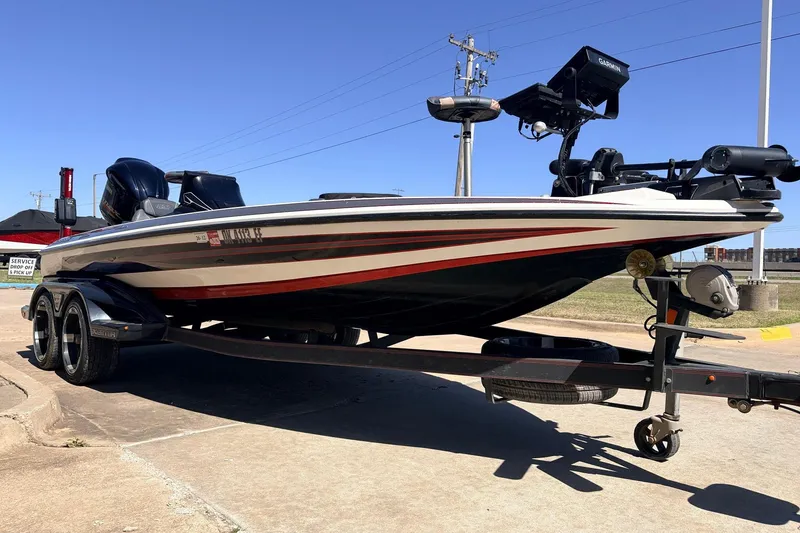 Slide: The Image of 2019 Skeeter FX21 Apex boat on trailer, featuring sleek design and advanced equipment. - 3