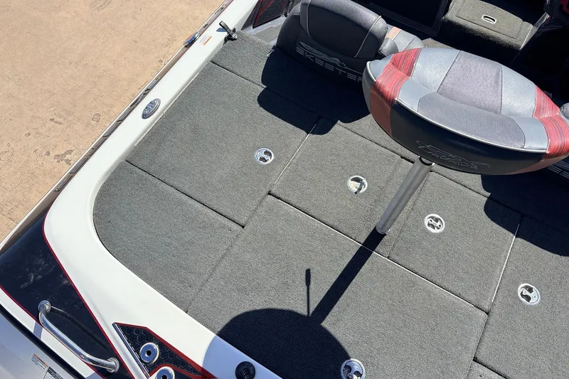 Slide: The Image of 2019 Skeeter FX21 Apex boat deck with seating and storage compartments. - 31