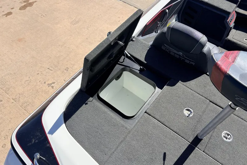 Slide: The Image of 2019 Skeeter FX21 Apex boat interior with open storage compartment. - 32