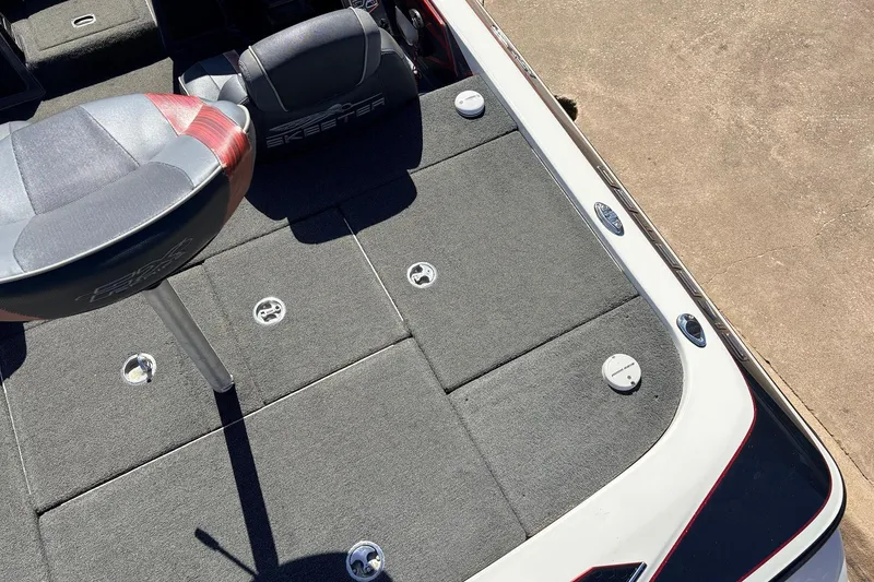Slide: The Image of 2019 Skeeter FX21 Apex boat deck with seating and storage compartments. - 33