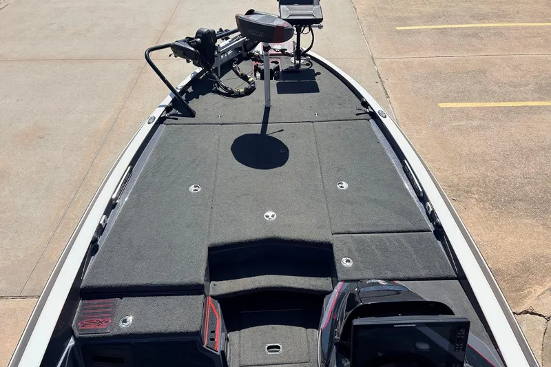 Slide: The Image of 2019 Skeeter FX21 Apex boat deck with advanced fishing equipment. - 9