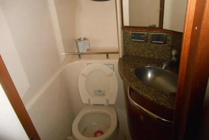 Slide: The Image of Interior of 2007 Sea Ray 44 Sundancer yacht with wooden steps and seating area. - 17