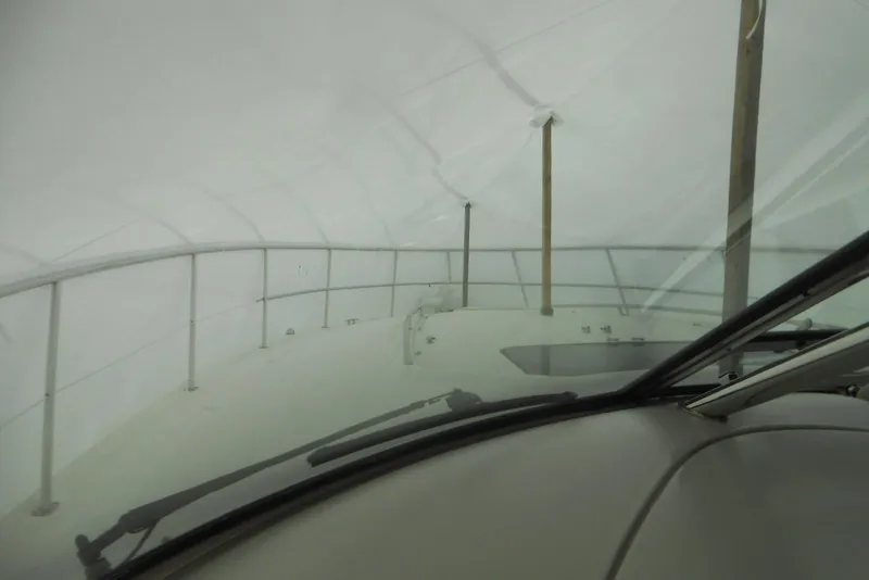 Slide: The Image of 2007 Sea Ray 44 Sundancer bathroom with toilet and sink, compact marine design. - 21