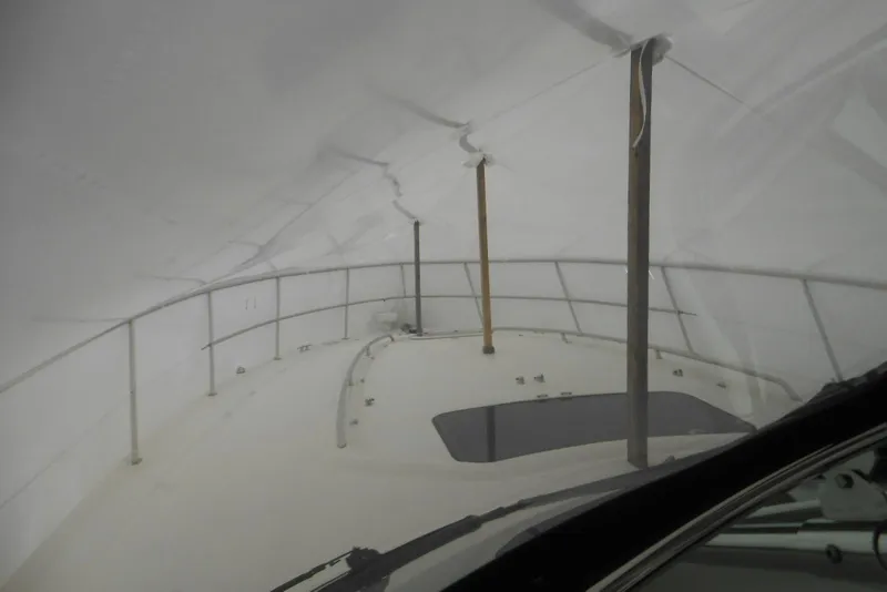 Slide: The Image of Cozy cabin interior of 2007 Sea Ray 44 Sundancer yacht with plush bedding. - 22