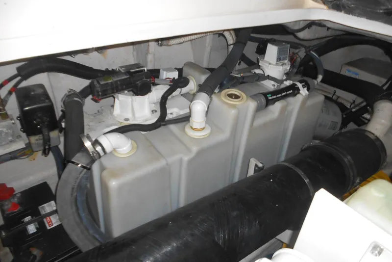 Slide: The Image of Engine compartment of a 2007 Sea Ray 44 Sundancer boat, showcasing mechanical components. - 30