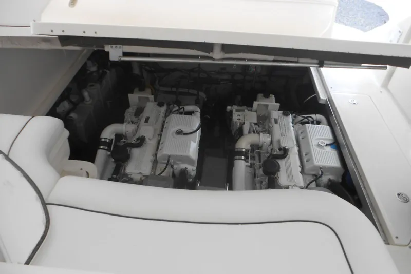 Slide: The Image of Engine compartment of 2007 Sea Ray 44 Sundancer with visible hoses and components. - 34