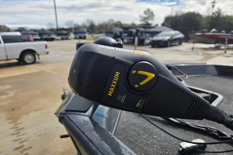 Slide: The Image of 2023 Ranger RT188P boat with Minn Kota Maxxum trolling motor in a parking lot. - 10